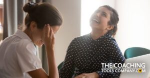 How to enroll life coaching clients well with coach and client enjoying themselves at a desk