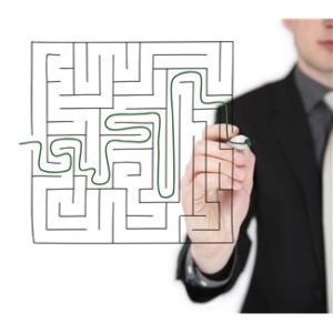 Business Coaching Tools shown by Man Finding Way out of maze