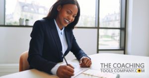 Client Setting Goals at desk for Why Set Goals article