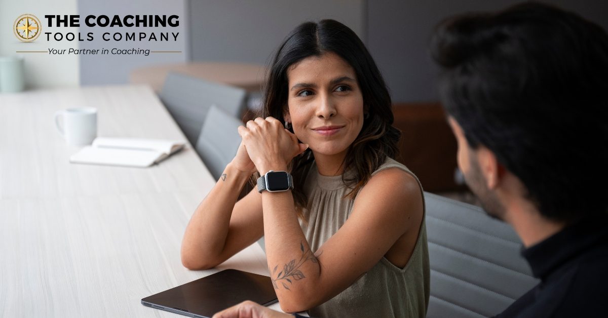 Smiling client with coach, showing trust and openness to change.